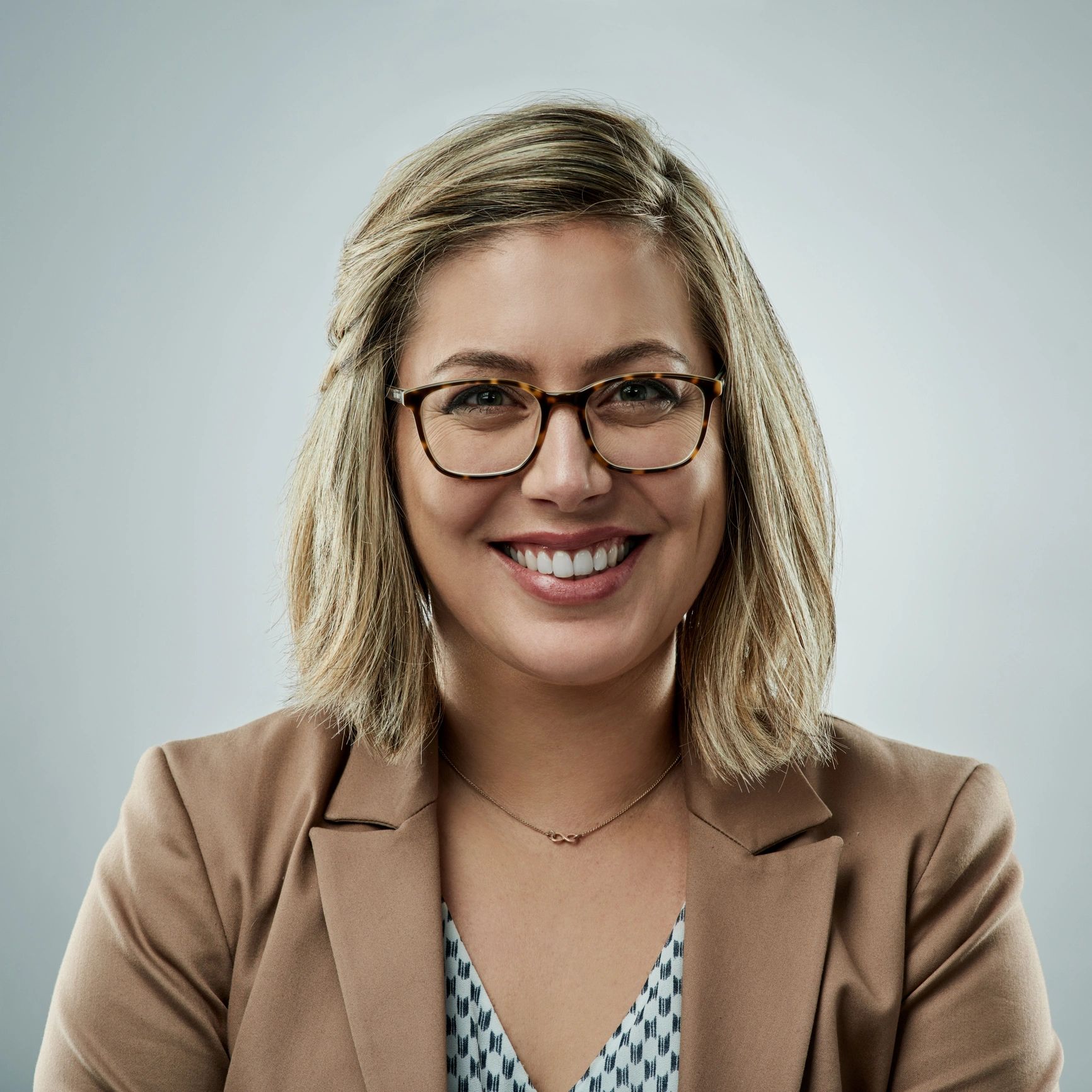 Professional headshot representing the analytical lead